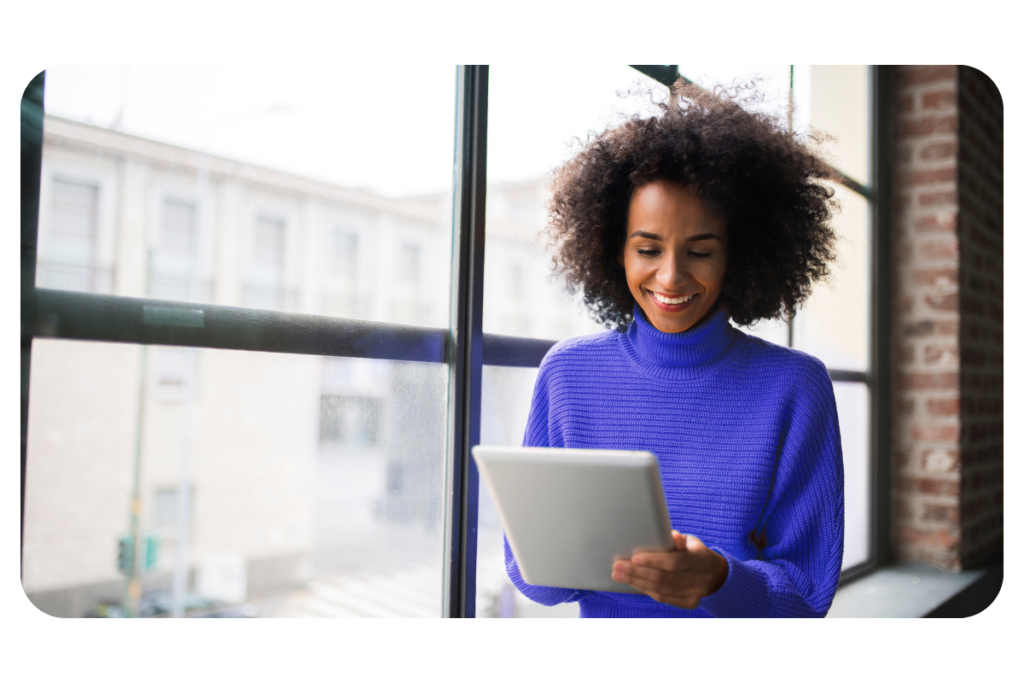 Woman, with tablet, by window