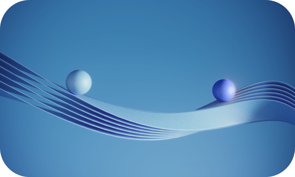 Two blue balls sitting on layers of blue sheets stacked on top of each other and twisting